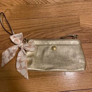 Gold coach wristlet with ribbon and coach keychain